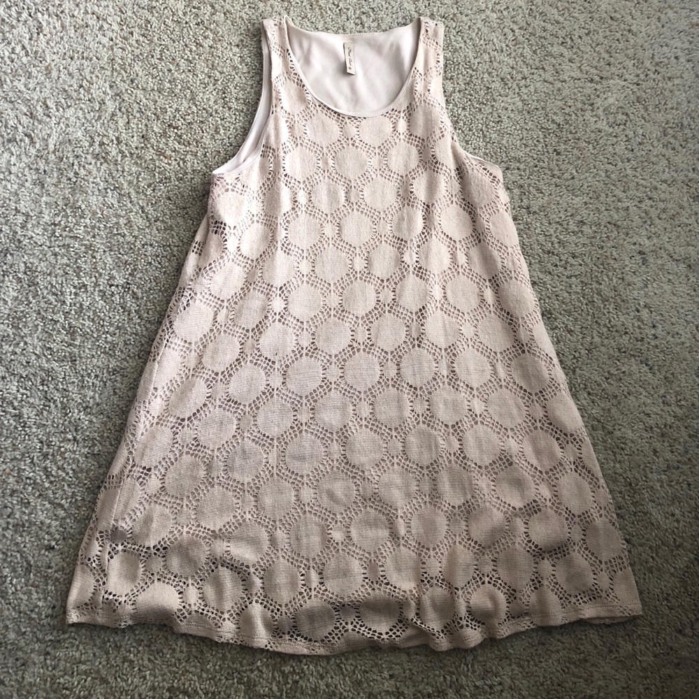Cream tank mini dress with circle detail. Size L.